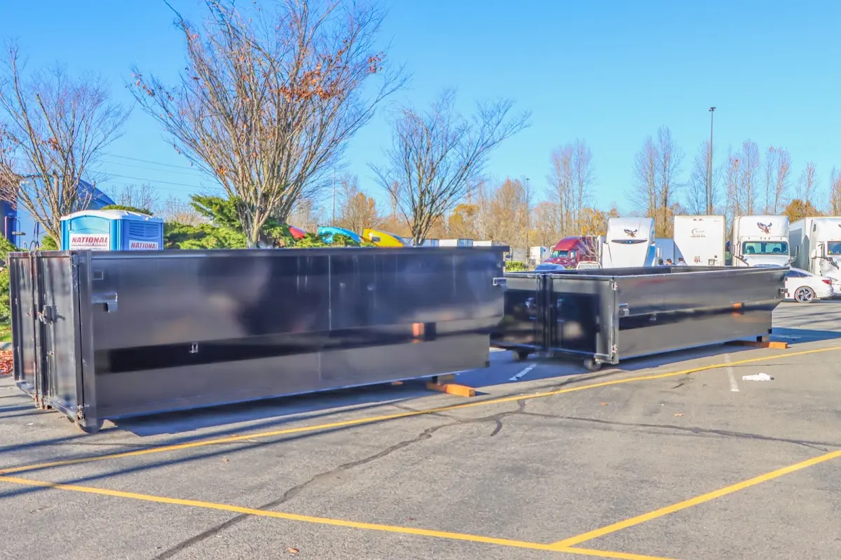 Professional dumpster rental service with roll-off container on residential driveway in Casselberry